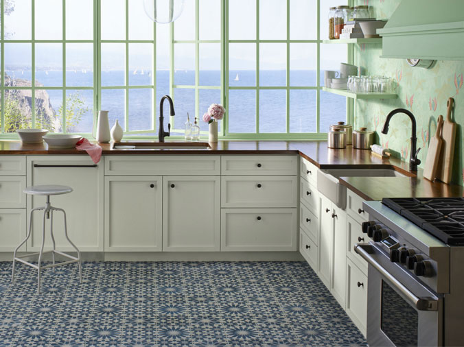 Kitchen with white cabinets and wood countertopw with large window